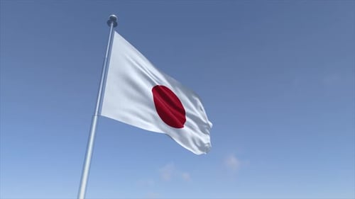 Japanese Flag Waving in Clear Blue Sky