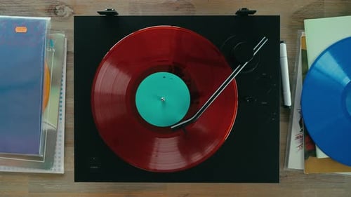 Red Vinyl Spinning on a Turntable