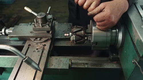 Close Up of Machinist Working on Machine