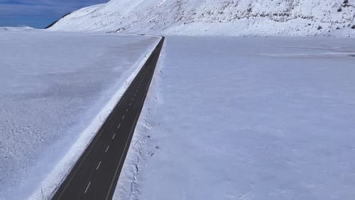 Aerial Drone View of Snowy Mountain Road in Abruzzo Italy