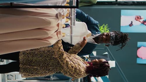 Adults Shopping for Clothing in Retail Store