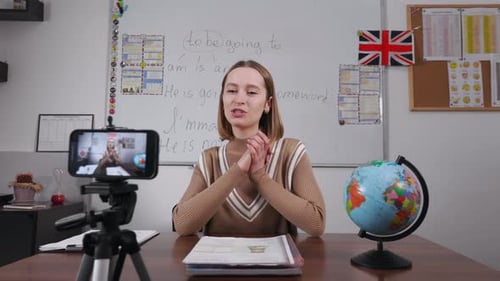 Tutor Recording Tutorial Video Using Phone Camera at School
