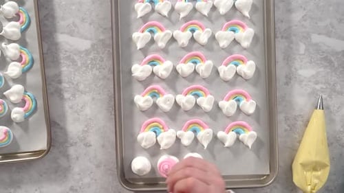 Flat Lay Step By Step Piping Meringue Mix Into Unicornshaped Pops on a Baking Sheet Lined with