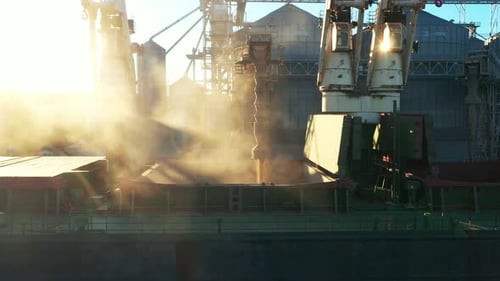 Aerial View Fom Above Wheat Loading to Bulker Ship Cargo Hold at Sea Grain Elevator in Sea Port