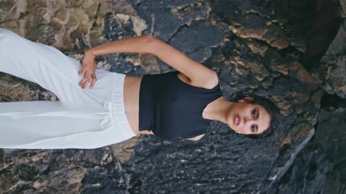 Glamour Model Posing Outdoors at Seashore Cliffs Vertical Stylish Brunette