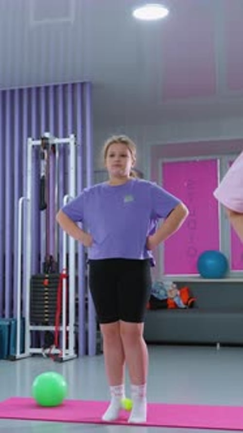 Instructor Coaching Students on Stamina Exercises in Gym