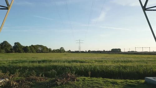 Drone shot Up of High Voltage Power Tower in Countryside