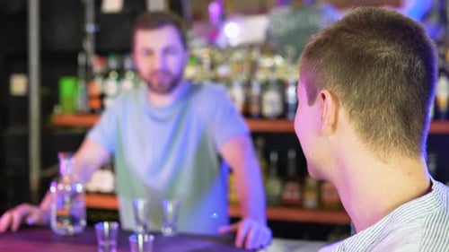 Male Customer Stand Near Counter Talk with Barista or Waiter Millennial Man Client Speak with Barmen