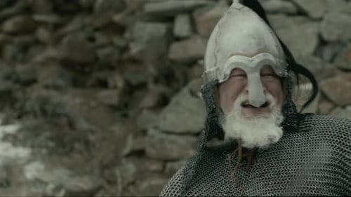 Grizzled Warrior in Medieval Armor Fighting with Enemy at Fortress