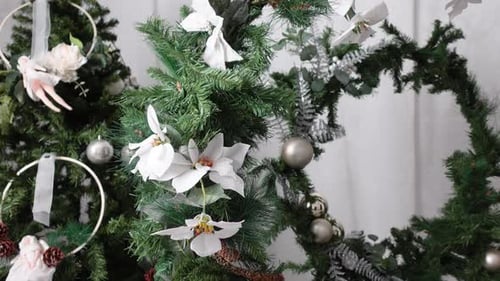 Elegant Christmas Decorations with Greenery and White Ornaments
