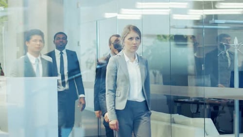 Diverse Team of Delegates/ Lawyers Led by Woman Confidently Marches Through the Corporate Building