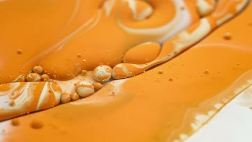 Orange Liquid with Spheres Abstract Macro