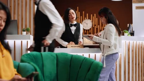 Hotel Lobby: Woman Uses Phone, Checking In