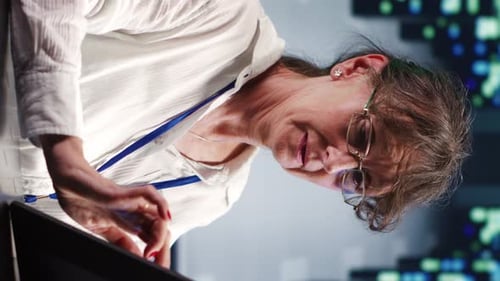 Adult Using Touch Screen Device in Office