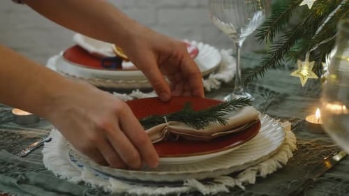 Festive holiday table setting with candles and decorations