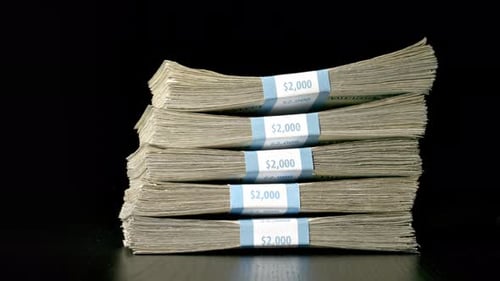 Money Falling On To A Table