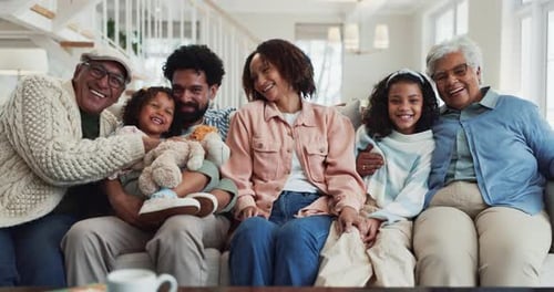 Happy Multi-Generation Family Smiling at Camera