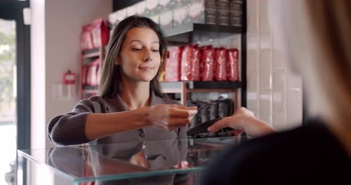 Happy Female Client Making Contactless Payment in Cafe