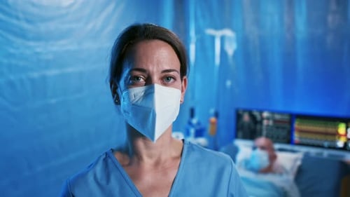 Frustrated Doctor By Patient Laying On Bed In Hospital, Coronavirus Concept.