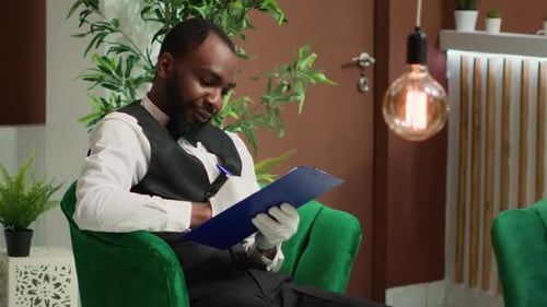 Friendly Hotel Porter Using Clipboard