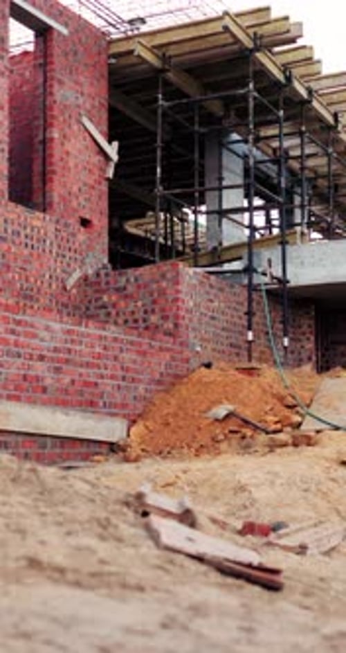 Construction, infrastructure and building with scaffolding on site for house improvement