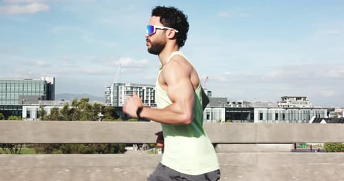 Fitness, running and man in city for cardio, workout and training for endurance marathon