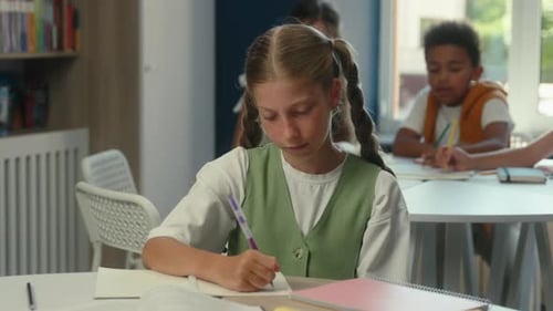Caucasian Child Kid Girl Schoolgirl Writing Homework Studying Showing Thumb Down Dislike Problem