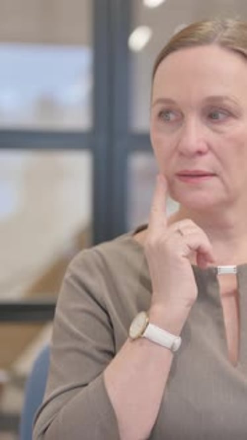 Portrait of Pensive Senior Businesswoman Thinking New Idea