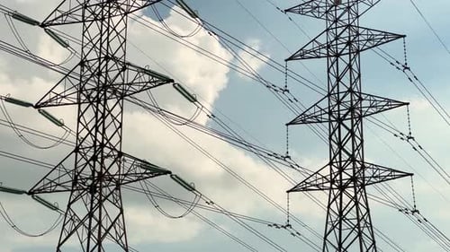 a close up of electrical tower grid during daytime