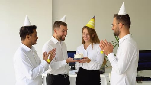 Business Team Celebrating a Birthday of Collegue in the Modern Office