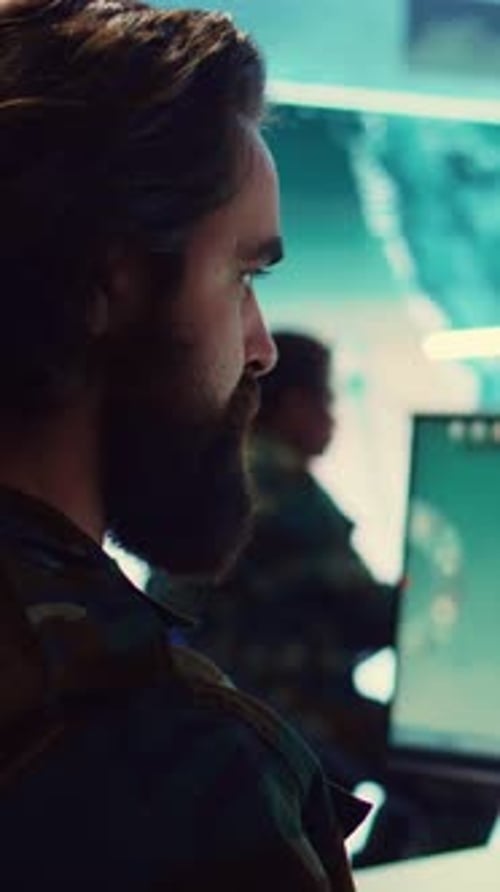 Vertical Video Army IT Professional Examining National Satellite Surveillance Footage
