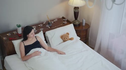 High Angle View Lonely Young Woman Lying in Bed with Teddy Bear Thinking Charming Caucasian Lady
