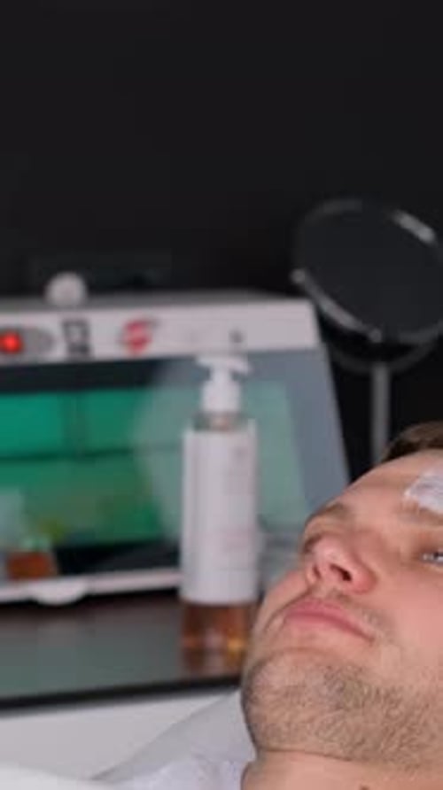 Man Receives Facial Skin Care Treatment