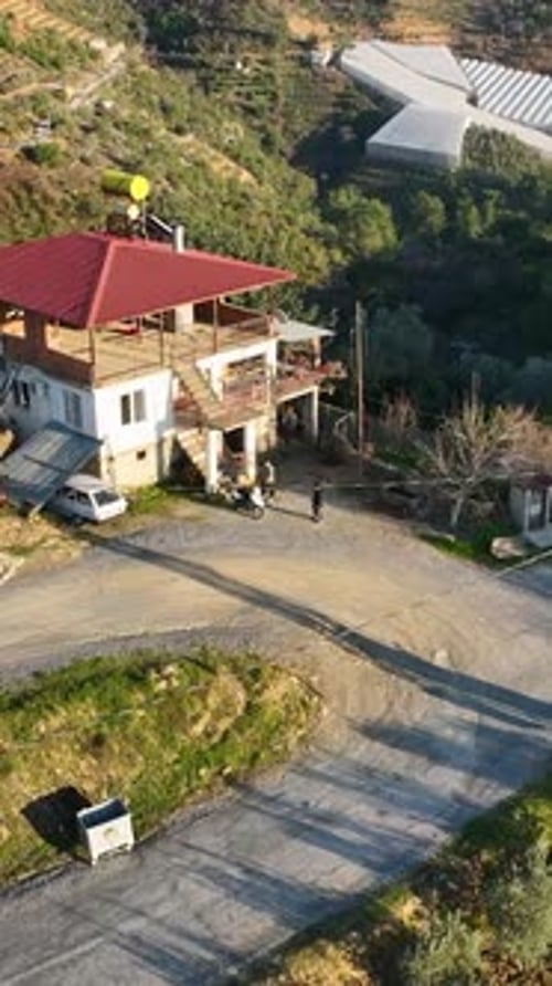 Vertical Video Above Serene Mountain Farming Villages Aerial View of Green Gardens and Forest