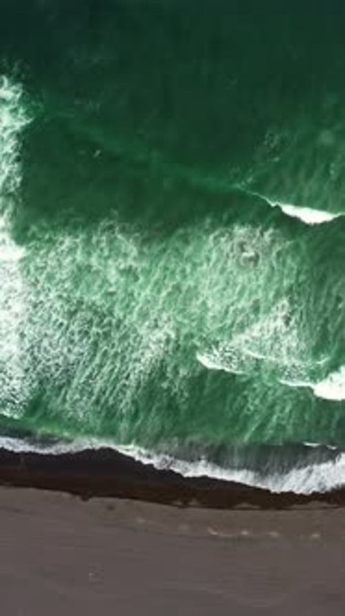 Aerial Top View of Beach with Black Sand