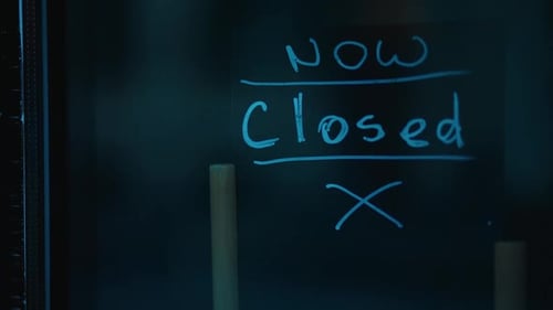 Now Closed Sign in Dark, Moody Lighting