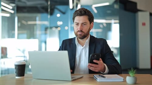 Focused Professional Works Diligently in Modern Office Environment