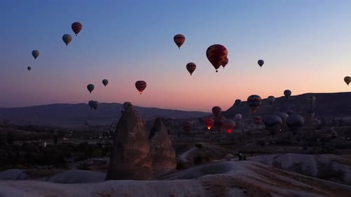 Breathtaking View of Hot Air Balloons at Sunrise