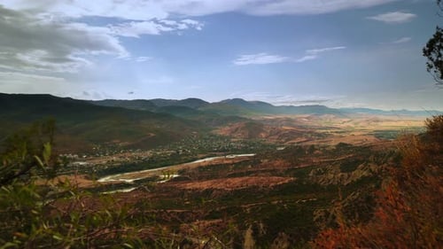 View on Village From High Mountain and Blue Sky with Moving Clouds at Windy Day in Timelapse