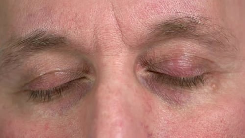 Close Up of Brown Eyes of Aged Mature Man