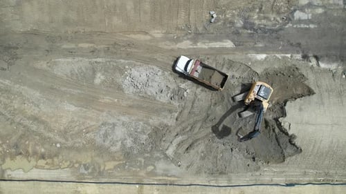 An aerial view of bucket crawler excavator on a summer sky background.Using a crawler excavator duri