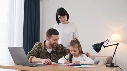 Loving Military Father Drawing with Daughter at Home