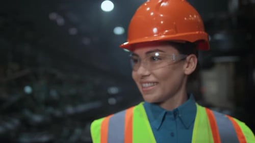 Uniformed Beautiful Woman Engineer Smiling at Professional Huge Manufacturing Company. Cheerful Indu