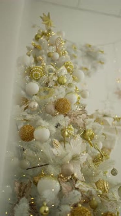 Elegant Christmas Tree with Golden Ornaments and Lights