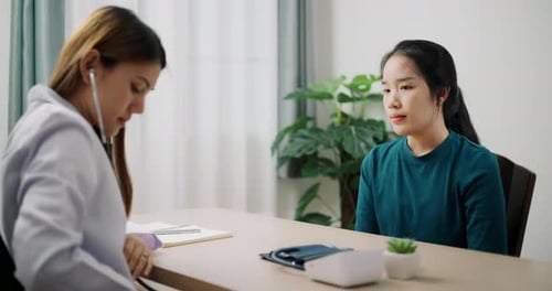 Doctor Examines Patient With Stethoscope in Medical Office