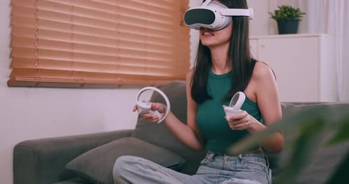 Woman Plays Virtual Reality Game at Home