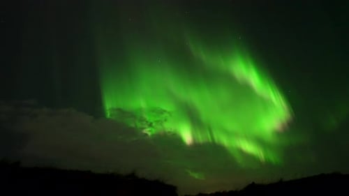 Bursting Aurora Borealis On Dark Evening Sky. Handheld