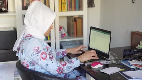 Beautiful Happy Muslim Arabic Woman Using Laptop Remote Work Home Office Indoors Female In Hijab