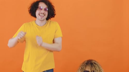 Curly Hair Man and Woman Dance with Enthusiasm