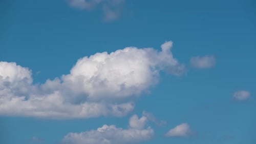 Clouds Moving Across Blue Sky Time-Lapse